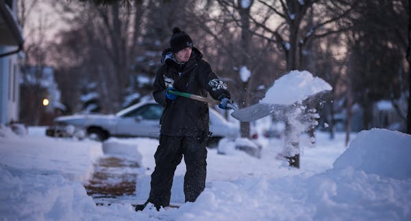 Justin Lang shoveled a driveway. "I just want people to be nice to one another," he said.