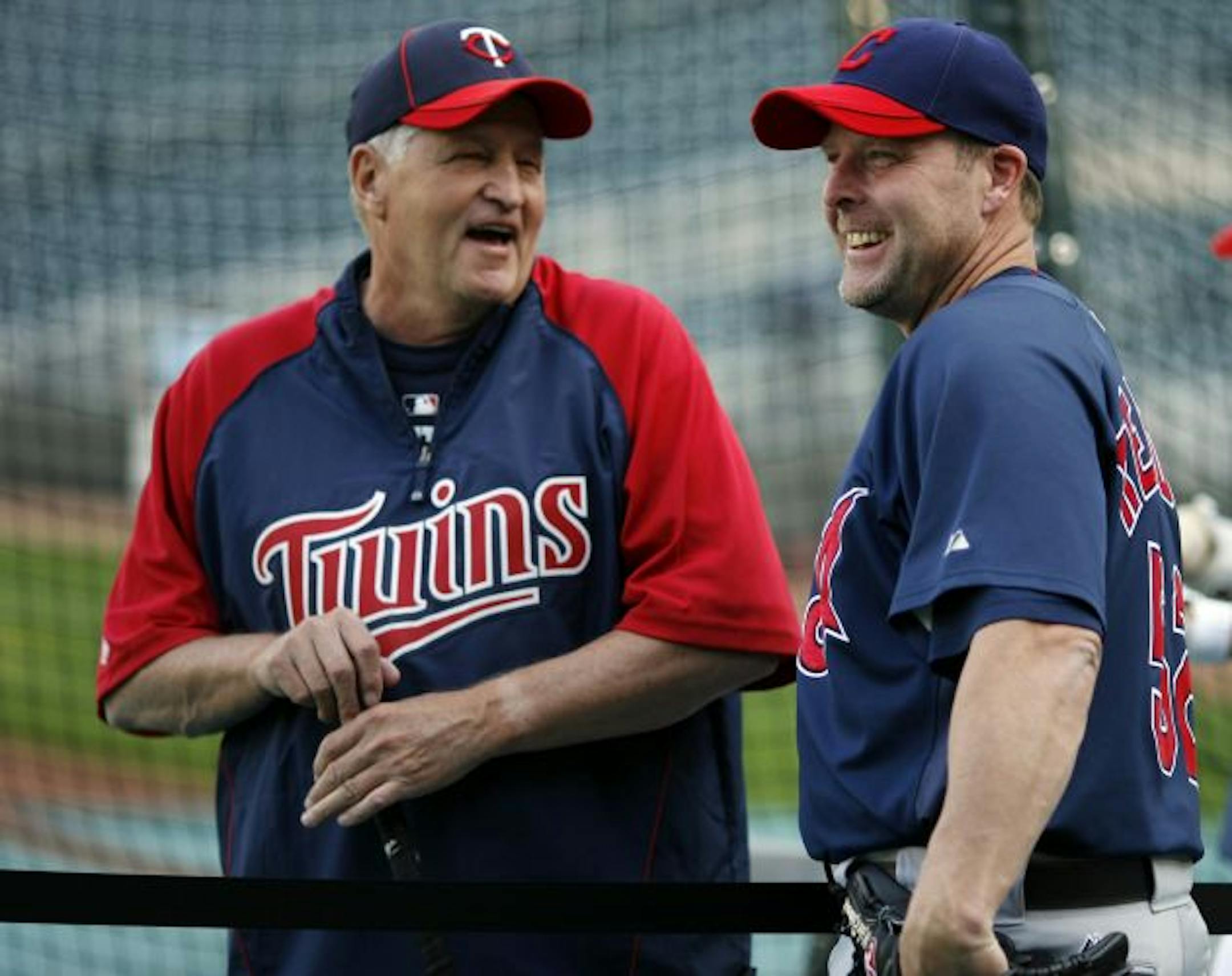 Twins bullpen coach Rick Stelmaszek (left), former Twins catcher Mike Redmond