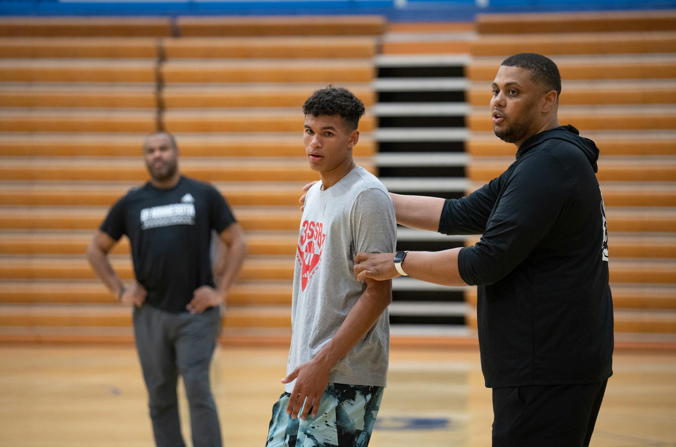 Head coach Jonathan Williams positioned Isaac Asuma in the right spot during practice at Wayzata Central Middle School in Plymouth.