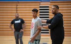 Head coach Jonathan Williams positioned Isaac Asuma in the right spot during practice at Wayzata Central Middle School in Plymouth.