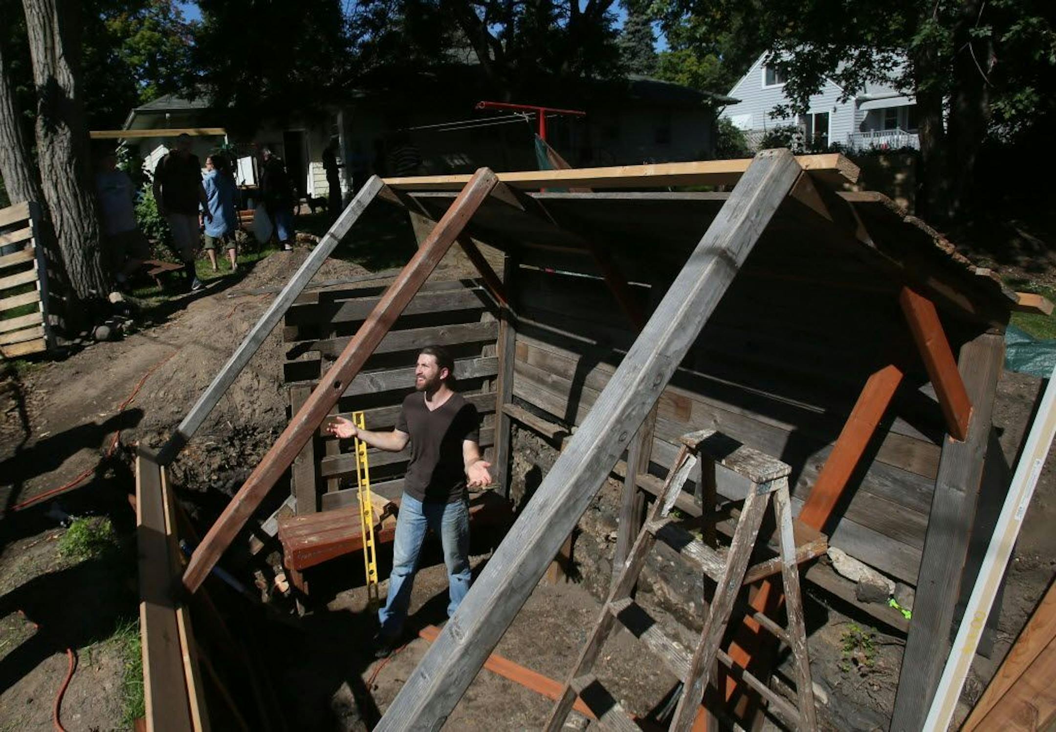 David Joles Michael Sophia of Seasons Unity Project inside the walipini being built in Sept. 2015 in Pastor Sarah Lawton's back yard, the parsonage for Northeast United Methodist Church in Minneapolis.