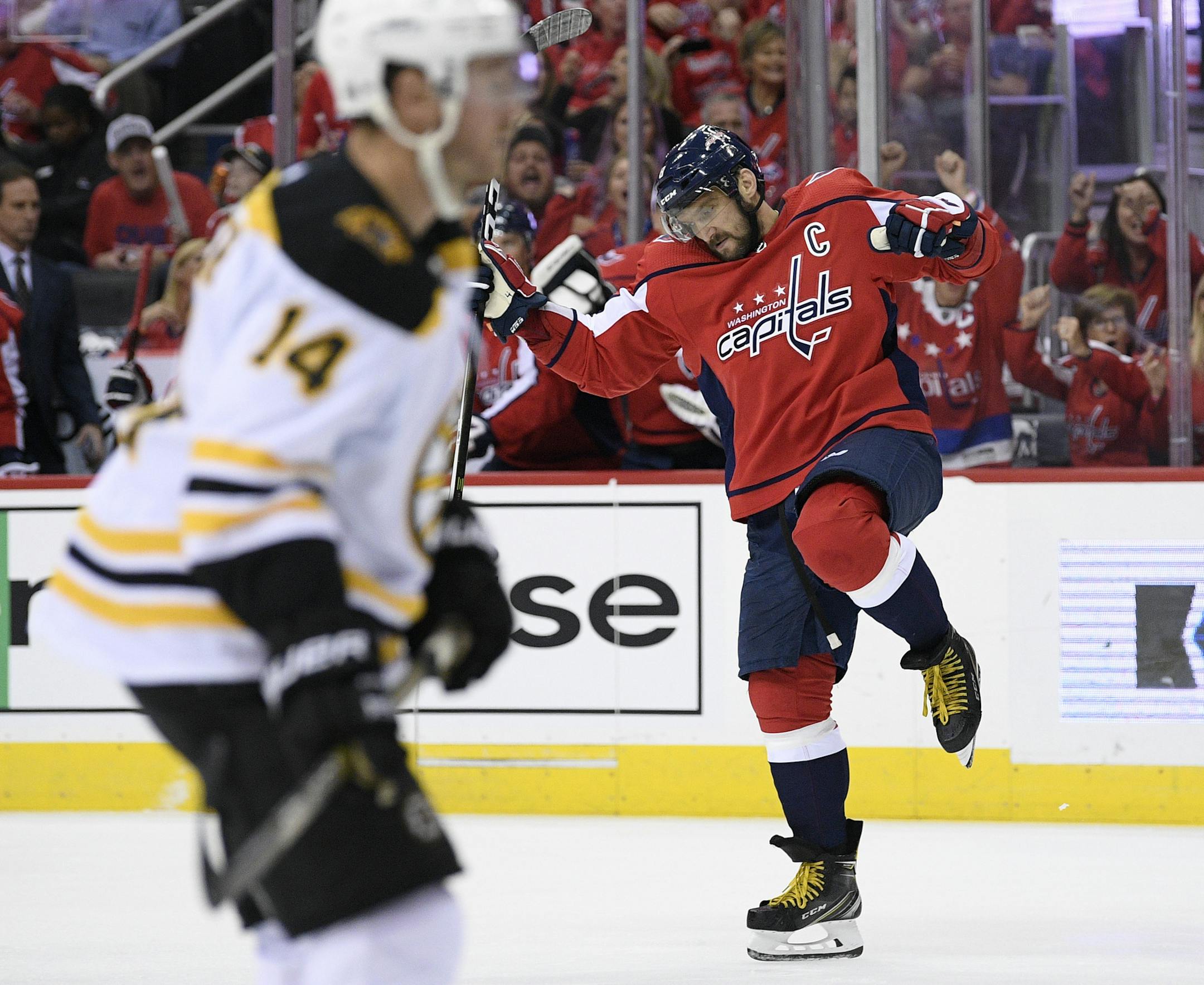 Washington Capitals left wing Alex Ovechkin, right, of Russia, celebrates his goal as Boston Bruins right wing Chris Wagner skates nearby during the second period of an NHL hockey game Wednesday, Oct. 3, 2018, in Washington. (AP Photo/Nick Wass)