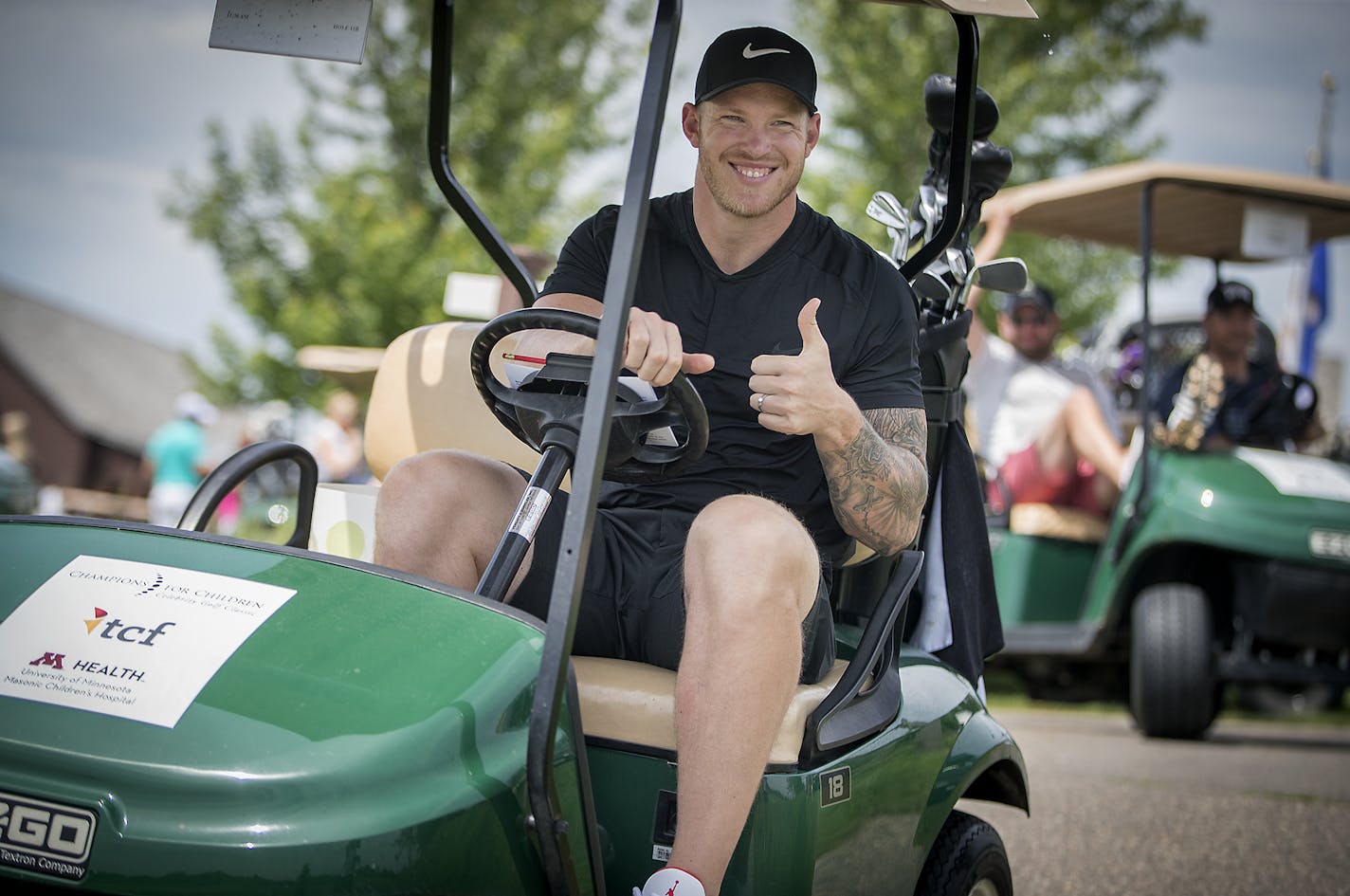 Vikings tight end Kyle Rudolph gave a thumbs-up as he made his way around the golf course followed by other golfers during a celebrity golf tournament for the University of Minnesota Health Masonic Children's Hospital, Monday, June 25, 2018 in Independence, MN. ] ELIZABETH FLORES &#xef; liz.flores@startribune.com