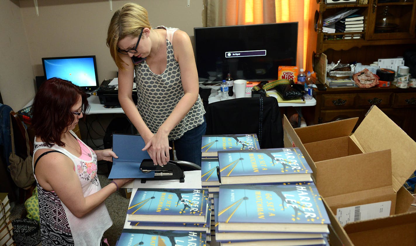 Jane MacAdam, far left, and Ginny Bordeaux embossed copies of "Go Set a Watchman" in Ol' Curiosities & Book Shoppe on the book's release date in the hometown of "To Kill a Mockingbird" author Harper Lee -- Monroeville, Ala.-- on Tuesday, July 14, 2015.