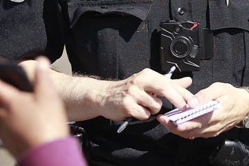 Columbia Heights police officer Terry Nightingale made sure to turn on his body cam before talking a pedestrian for dangerously crossing the street, F