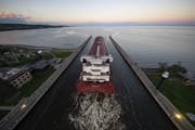 The Edwin H Gott passed under the Aerial Lift Bridge in Duluth on Tuesday evening as it began its journey on Lake Superior to the Canadian port of Nan