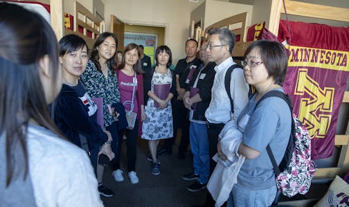 Pai Liu, left, led a group from China on a tour during orientation for parents of incoming U freshmen last summer.