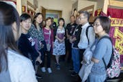 Pai Liu, left, led a group from China on a tour during orientation for parents of incoming U freshmen last summer.