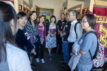 Pai Liu, left, led a group from China on a tour during orientation for parents of incoming U freshmen last summer.