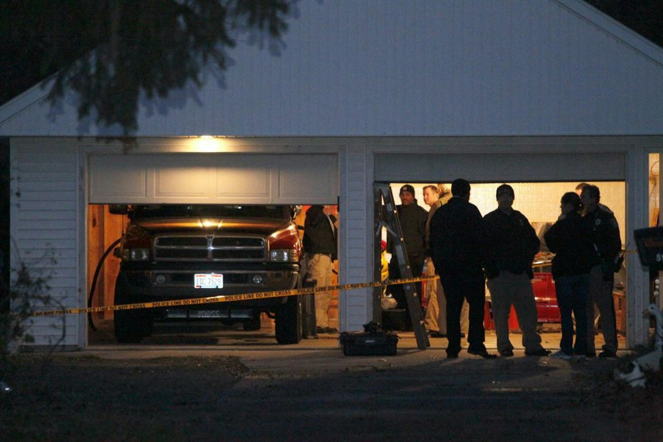Authorities respond to a report of carbon monoxide poisoning on Harvest Lane in Toledo, Ohio, on Monday, Nov. 12, 2012. The bodies of three children and two adults were found inside the garage Monday, and authorities said they believe the deaths � apparently from carbon monoxide poisoning � weren't accidental.