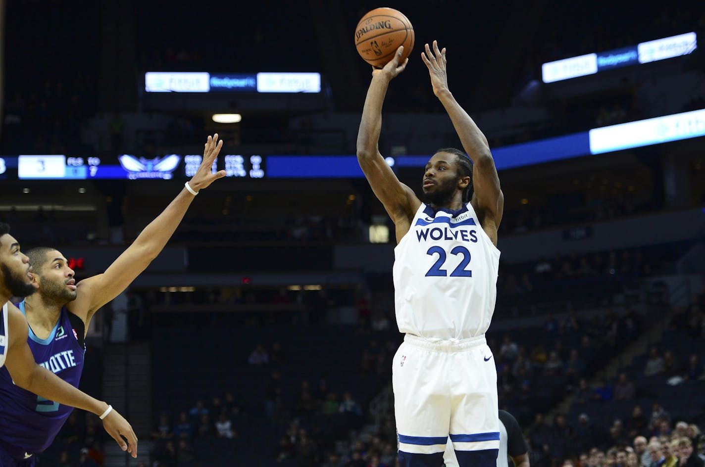 Minnesota Timberwolves forward Andrew Wiggins (22) hit a 3-pointer under pressure in the first half against the Charlotte Hornets. ] Aaron Lavinsky &#xa5; aaron.lavinsky@startribune.com The Minnesota Timberwolves played the Charlotte Hornets on Wednesday, Dec. 5, 2018 at Target Center in Minneapolis, Minn.