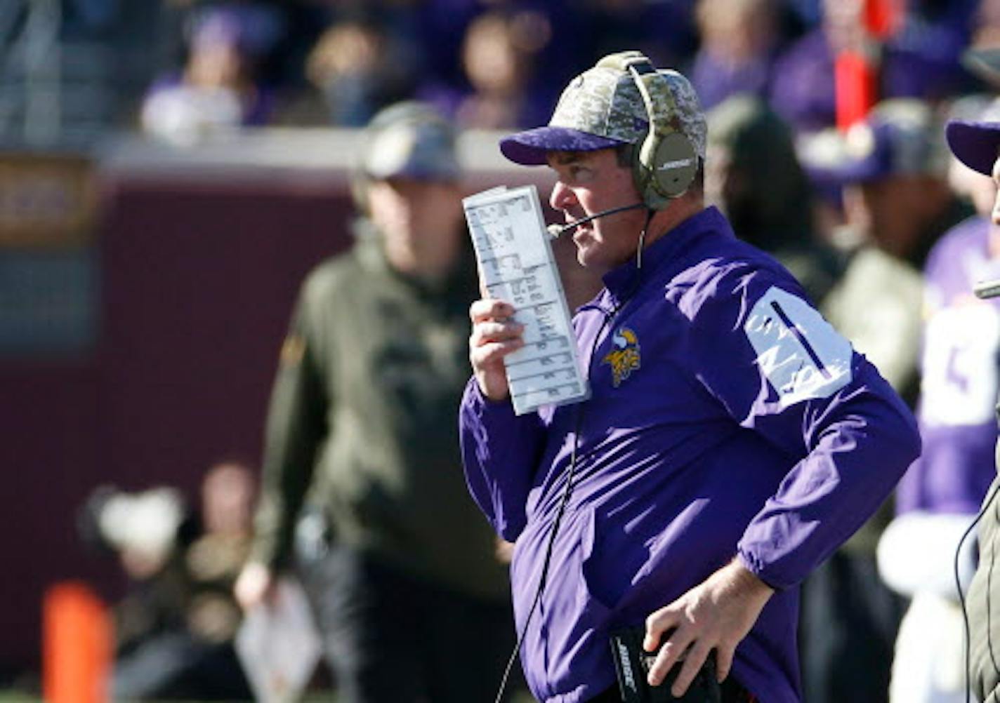 Minnesota Vikings head coach Mike Zimmer calls a play from the sidelines during the first half of an NFL football game against the St. Louis Rams, Sunday, Nov. 8, 2015, in Minneapolis. (AP Photo/Ann Heisenfelt)