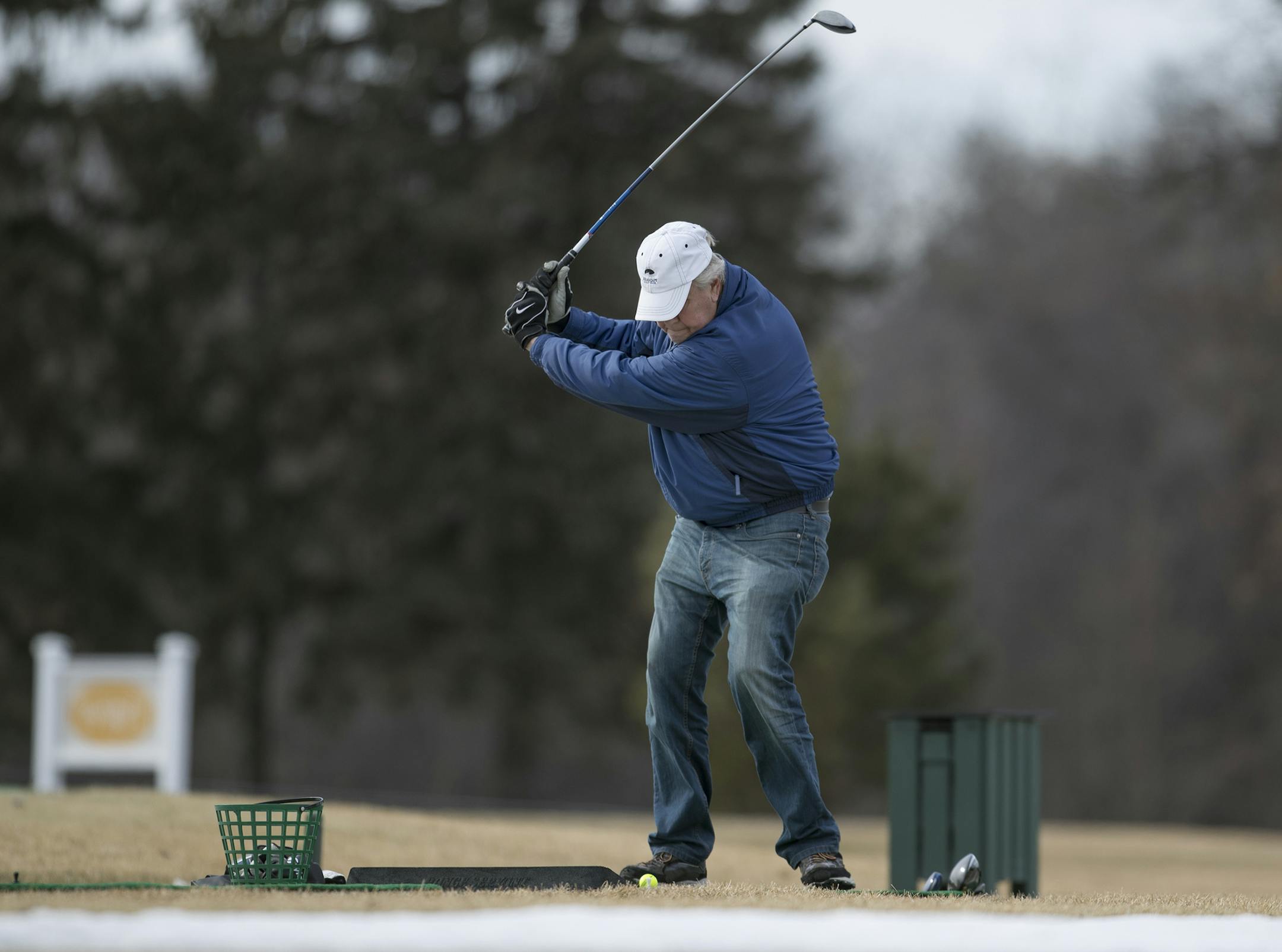 Jim Seeman worked on his swing at lunch at the driving range on Bunker Hills Golf course on Thursday 16, 2017 in Coon Rapids, MN.] The recent affects of the warm weather on winter activities and commerce. JERRY HOLT ï jerry.holt@startribune.com