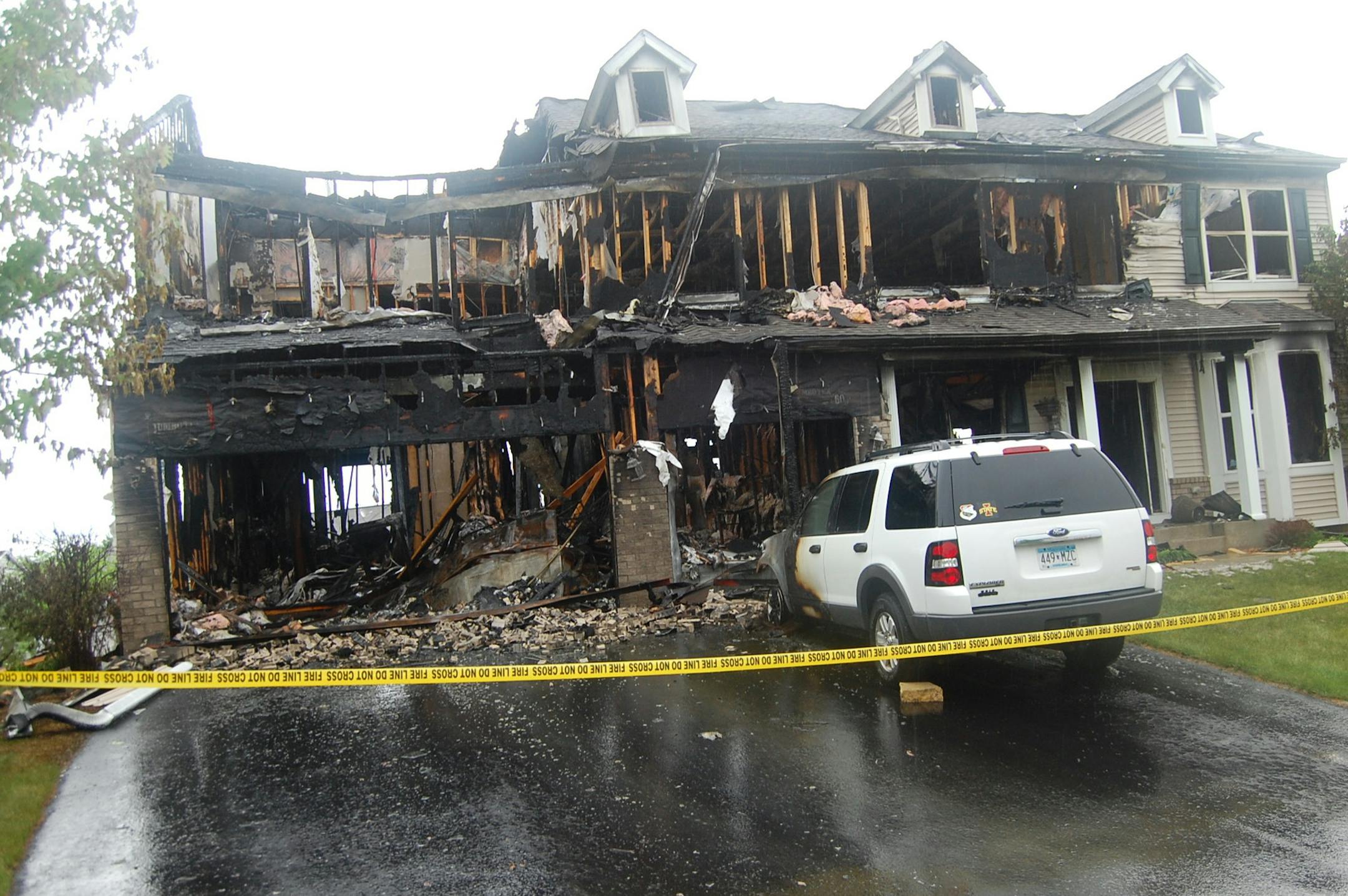 Chaska Fire Department photo: Heat and flames quickly consumed this large house in Chaska in May and singed nearby homes. The Chaska department supports putting sprinklers in large homes.