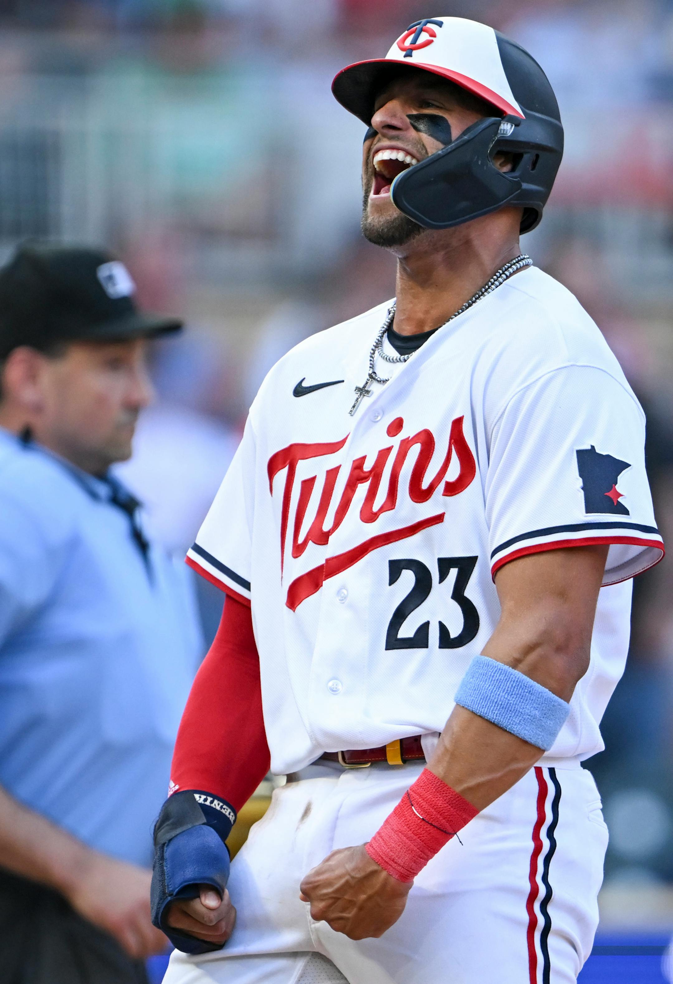 Minnesota Twins third baseman Royce Lewis (23) celebrates after sliding home safely for a run after a single hit by catcher Christian Vazquez (8) in the bottom of the second inning against the Boston Red Sox Wednesday, June 21, 2023, at Target Field in Minneapolis, Minn.