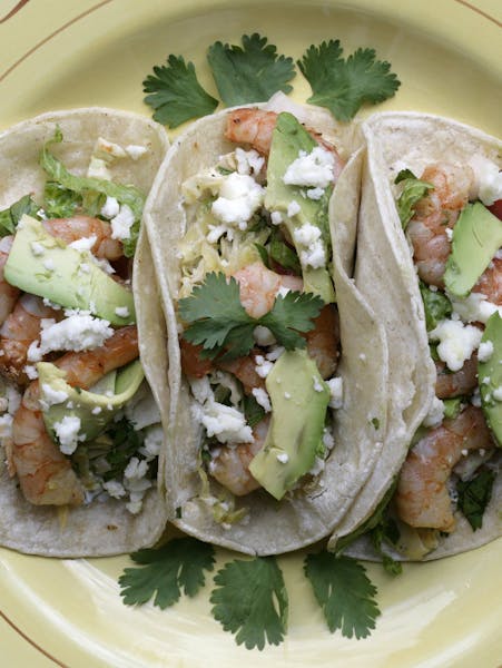 Shrimp Tacos get an extra kick from a marinade that includes chipotle pepper in adobo sauce. (Patricia Beck/Detroit Free Press/MCT) ORG XMIT: 1156136