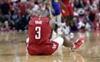 Houston Rockets guard Chris Paul sits on the court following a play during the second half in Game 6 of the team's second-round NBA basketball playoff