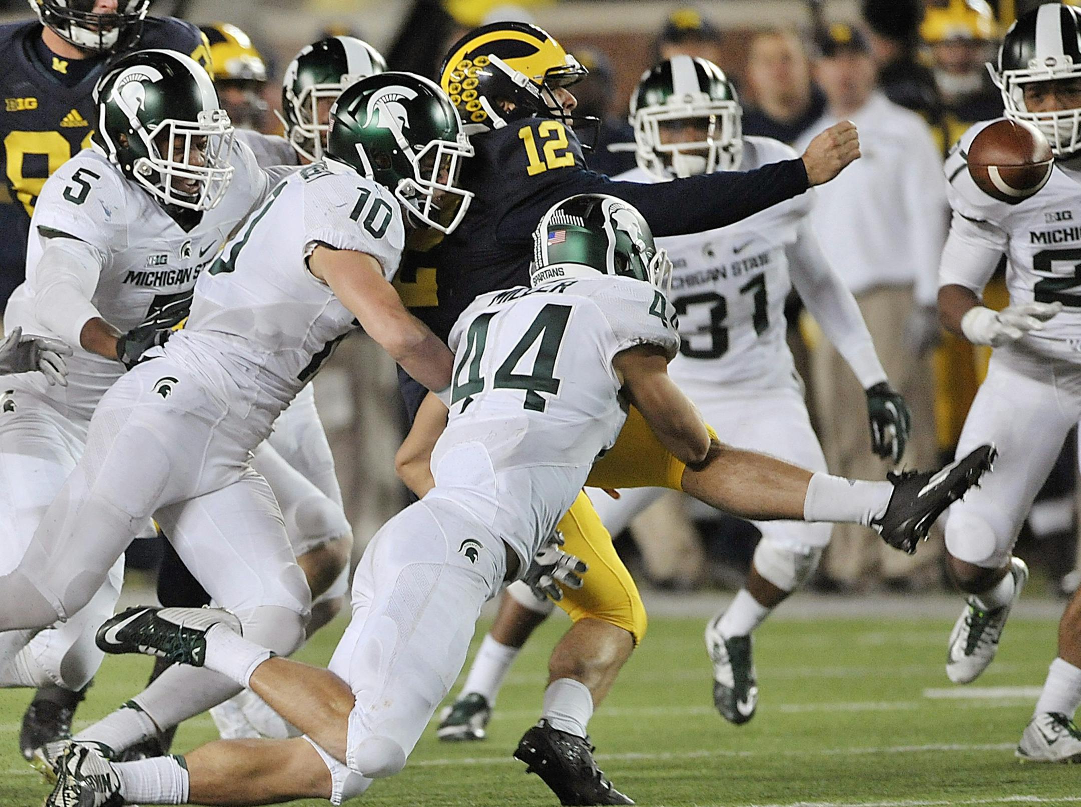 Fast forward to 2015, when a bobbled snap by Michigan punter Blake O’Neill (12) not only cost Michigan a victory but subjected O’Neilll to a tidal wave of harsh feedback via social media that included death threats.