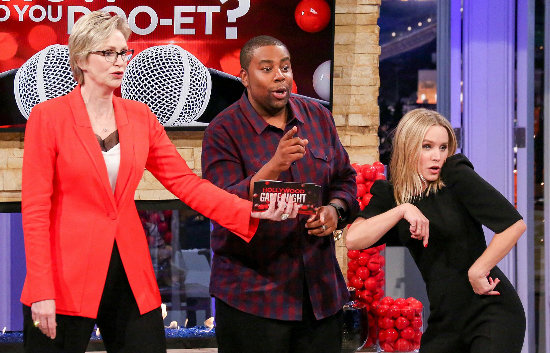 "Hollywood Game Night" host Jane Lynch with "Red Nose Day" participants Kenan Thompson and Kristen Bell.