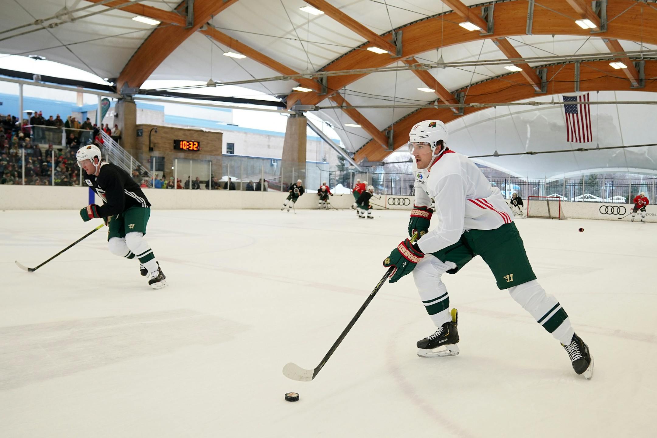 Minnesota Wild left wing Marcus Foligno (17) took the puck down the ice during the Wild's outdoor practice Thursday.