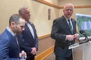 Gov. Tim Walz speaks at a news conference about the new Meta data center in Rosemount with Brad Davis, director of data center community development f