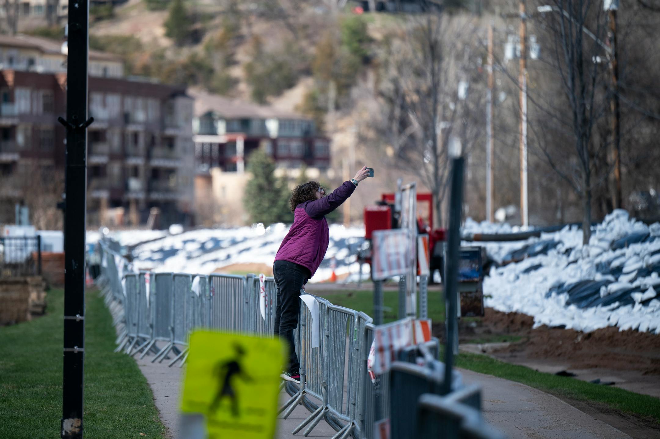 Michele Stewart, of Siren, Wisc., takes a photo of the St. Croix River Monday, April 17, 2023 in Stillwater, Minn.