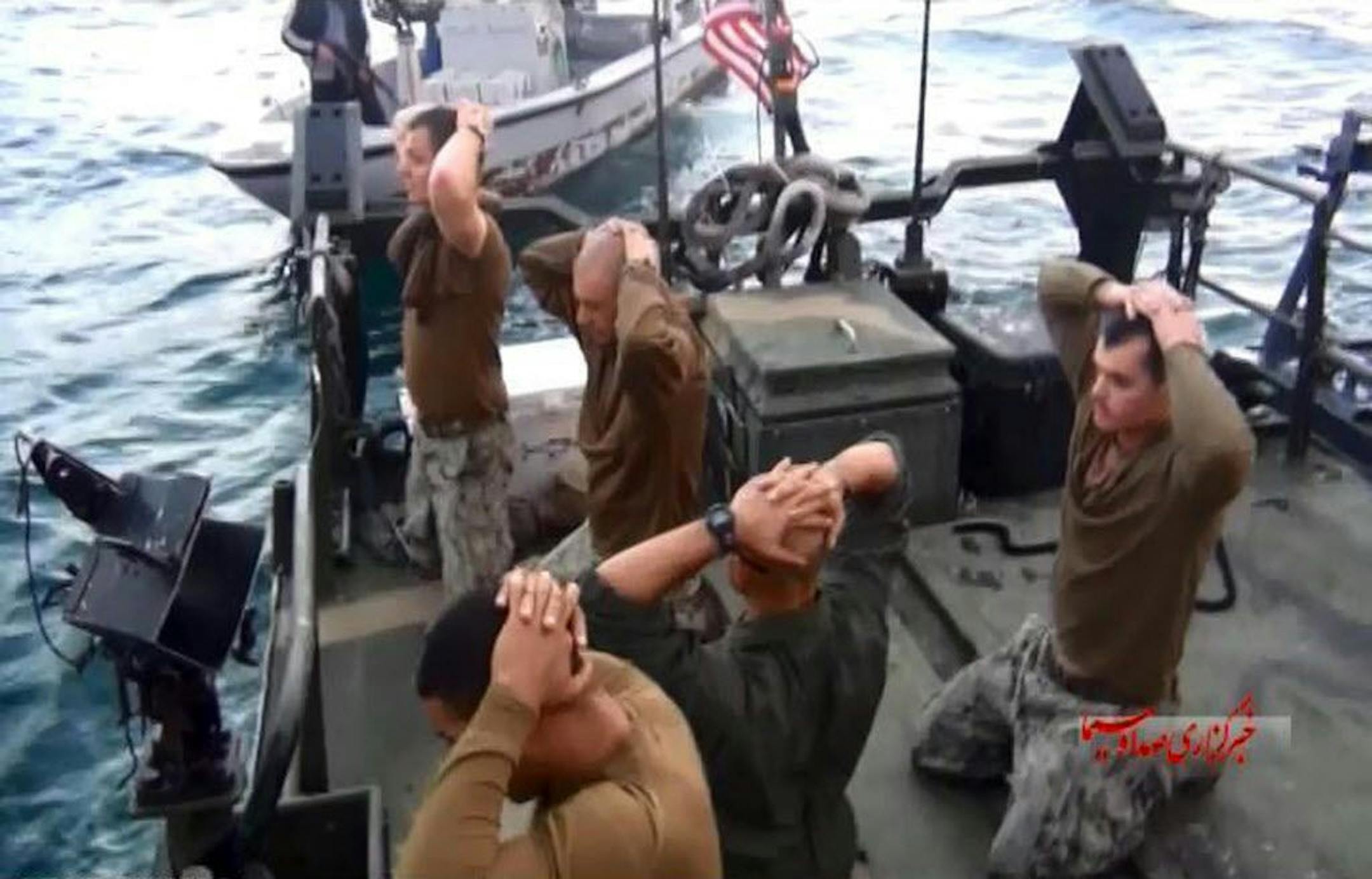 This frame grab from Tuesday, January 12, 2016 video by the Iranian state-run IRIB News Agency, shows detention of American Navy sailors by the Iranian Revolutionary Guards in the Persian Gulf, Iran. The 10 U.S. Navy sailors detained by Iran after their two small boats allegedly drifted into Iranian territorial waters around one of Iran's Persian Gulf islands a day earlier have been freed, the United States and Iran said Wednesday.