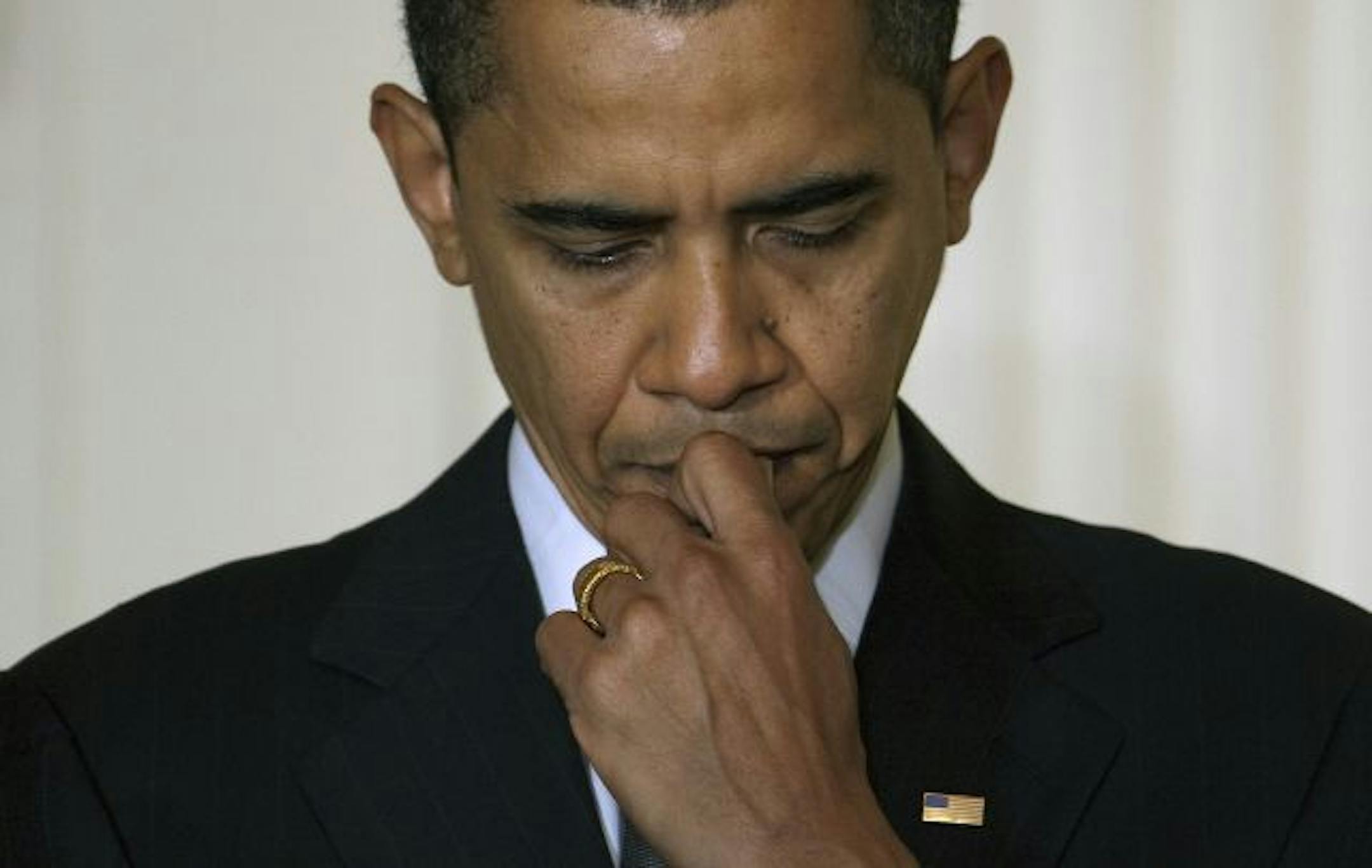 President Barack Obama listens as Vice President Joe Biden speaks to mayors from cities across the United States, Friday, Feb. 20, 2009, in the East Room of the White House.