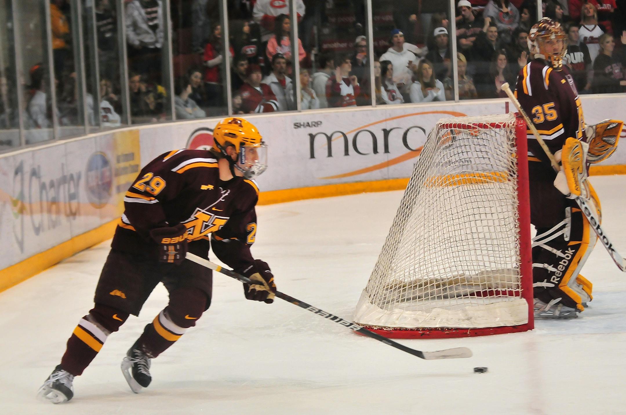 Minnesota's right defenseman, Nate Schmidt (29), brings the puck around the net and away from Gopher territory during the first period against St. Cloud State University Saturday, January 28 at the National Hockey Center in St. Cloud. Photo by Bre McGee.