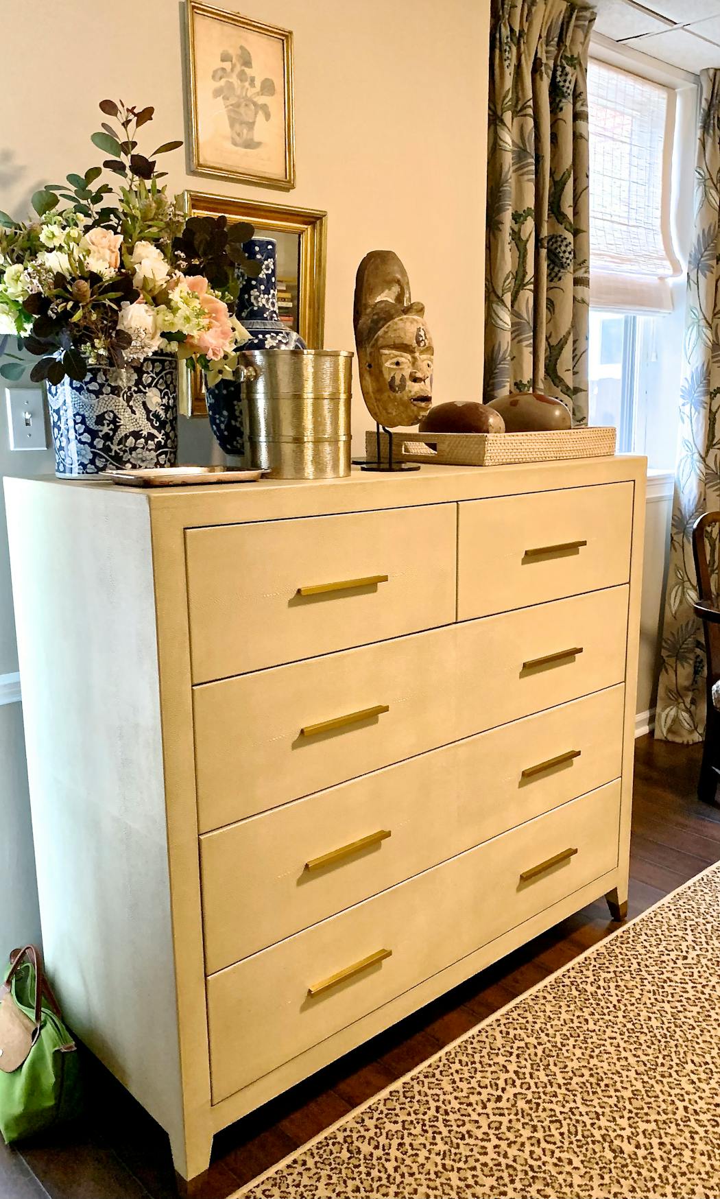 The Shagreen chest in designer Jim Miller’s apartment holds his African masks, river rocks from India and a floral arrangement by Anne Dickson owner of Fox and the Fluer. 