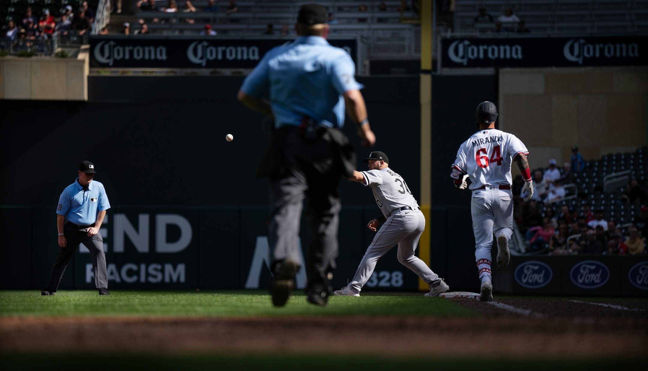 Twins first baseman Jose Miranda (64) grounded out in the 9th inning as Chicago White Sox first baseman Jake Burger (30) waited for the ball.