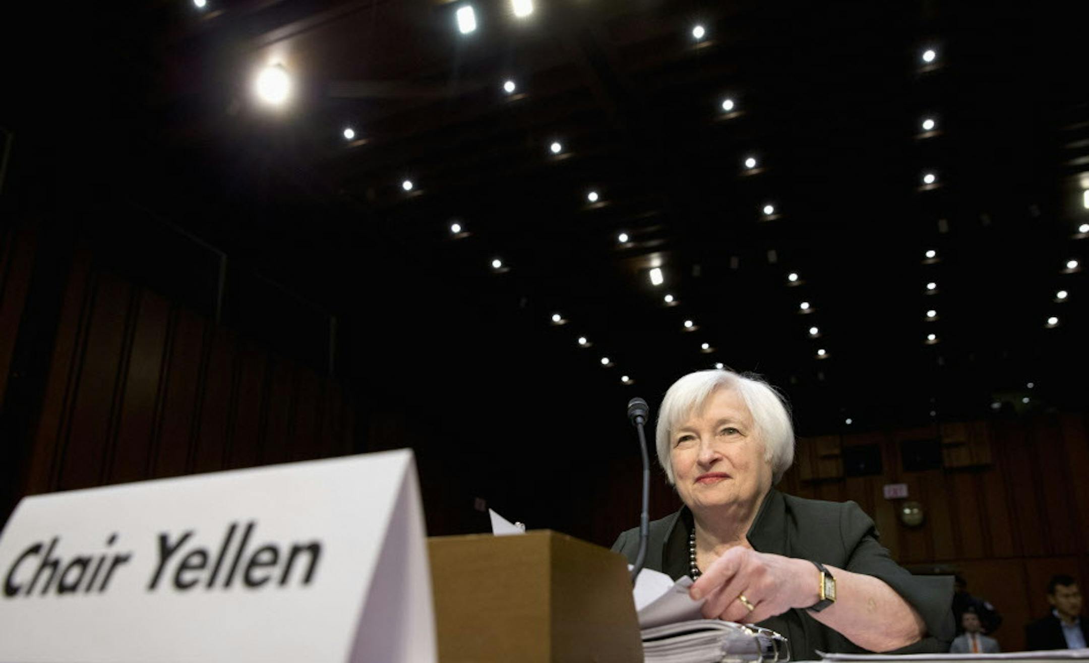 FILE - In this Thursday, Dec. 3, 2015, file photo, Federal Reserve Chair Janet Yellen prepares to testify on Capitol Hill in Washington, before the Joint Economic Committee. The Federal Reserve raised its key interest rate in mid-December from record lows and signaled the likelihood of four more hikes in 2016. Yet as Yellen addresses Congress on Wednesday, Feb. 10, 2016, turbulent markets, global weakness and slowdowns in key sectors are expected to lead the Fed to raise rates fewer than four ti