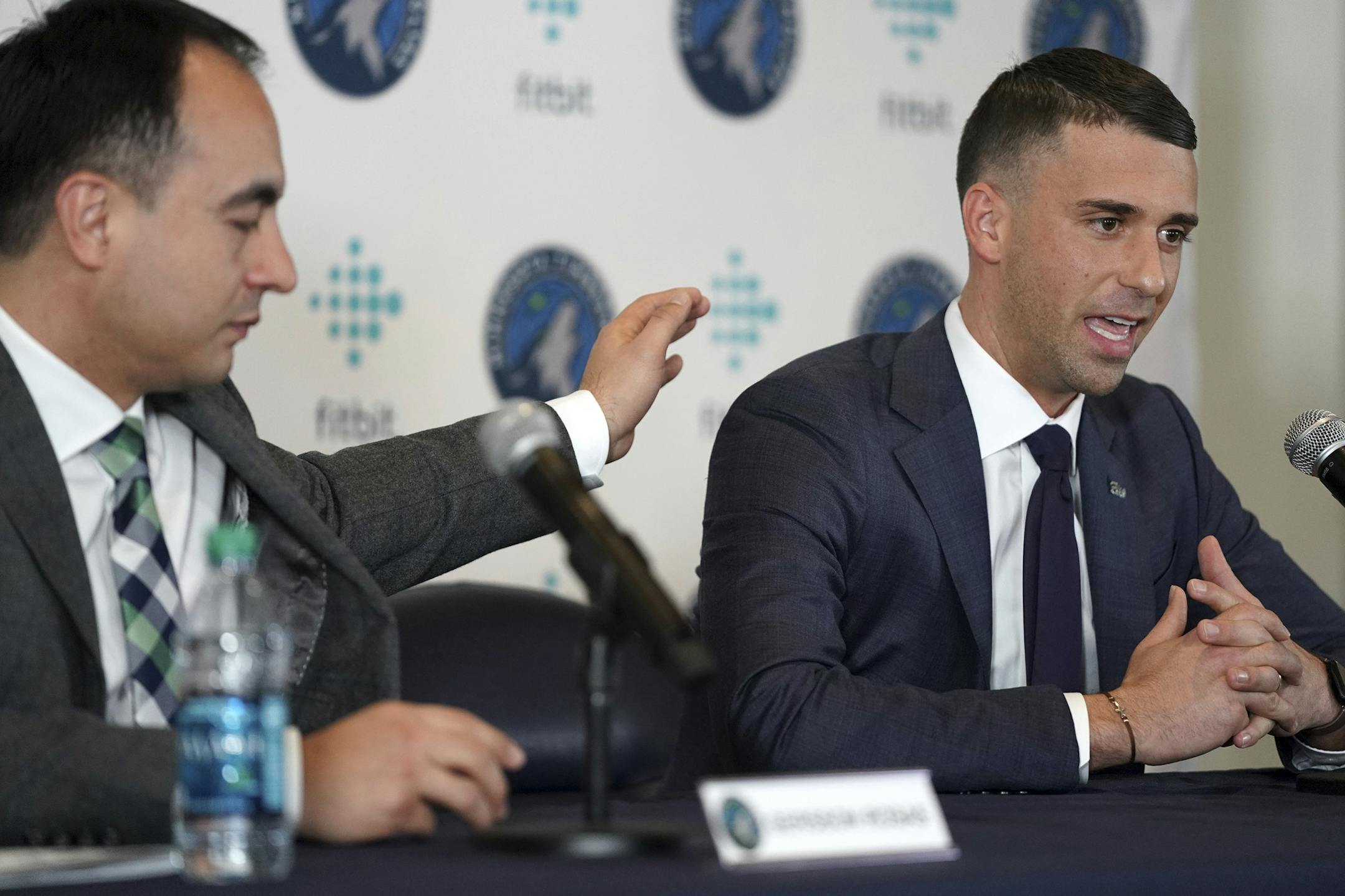 Minnesota Timberwolves NBA basketball team President of Basketball Operations Gersson Rosas, left, pats new head coach Ryan Saunders on the shoulder during a press conference in Minneapolis, Tuesday, May 21, 2019. (Anthony Souffle/Star Tribune via AP)
