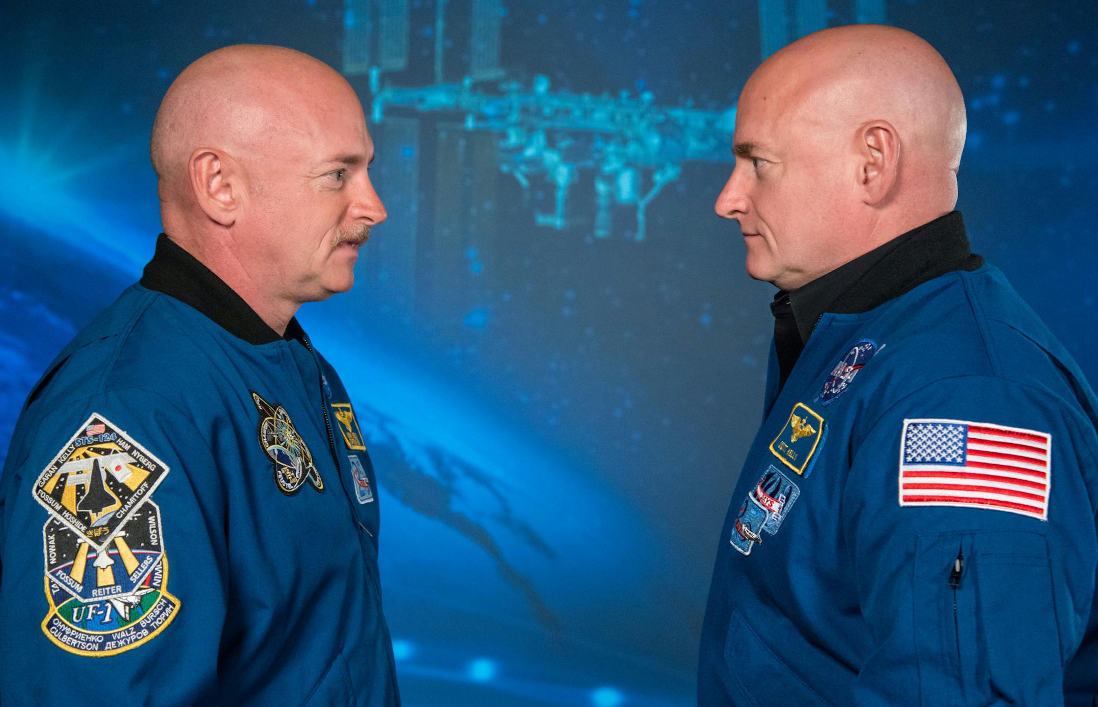 In an image provided by NASA, Astronaut Scott Kelly, right, and his twin brother, Mark Kelly, Jan. 19, 2015. For 340 days, NASA scientists meticulously compared the twins, one in orbit, the other, earthbound. The results hint at what humans will have to endure on long journeys through space. (Robert Markowitz/JSC/NASA via The New York Times) -- FOR EDITORIAL USE ONLY --