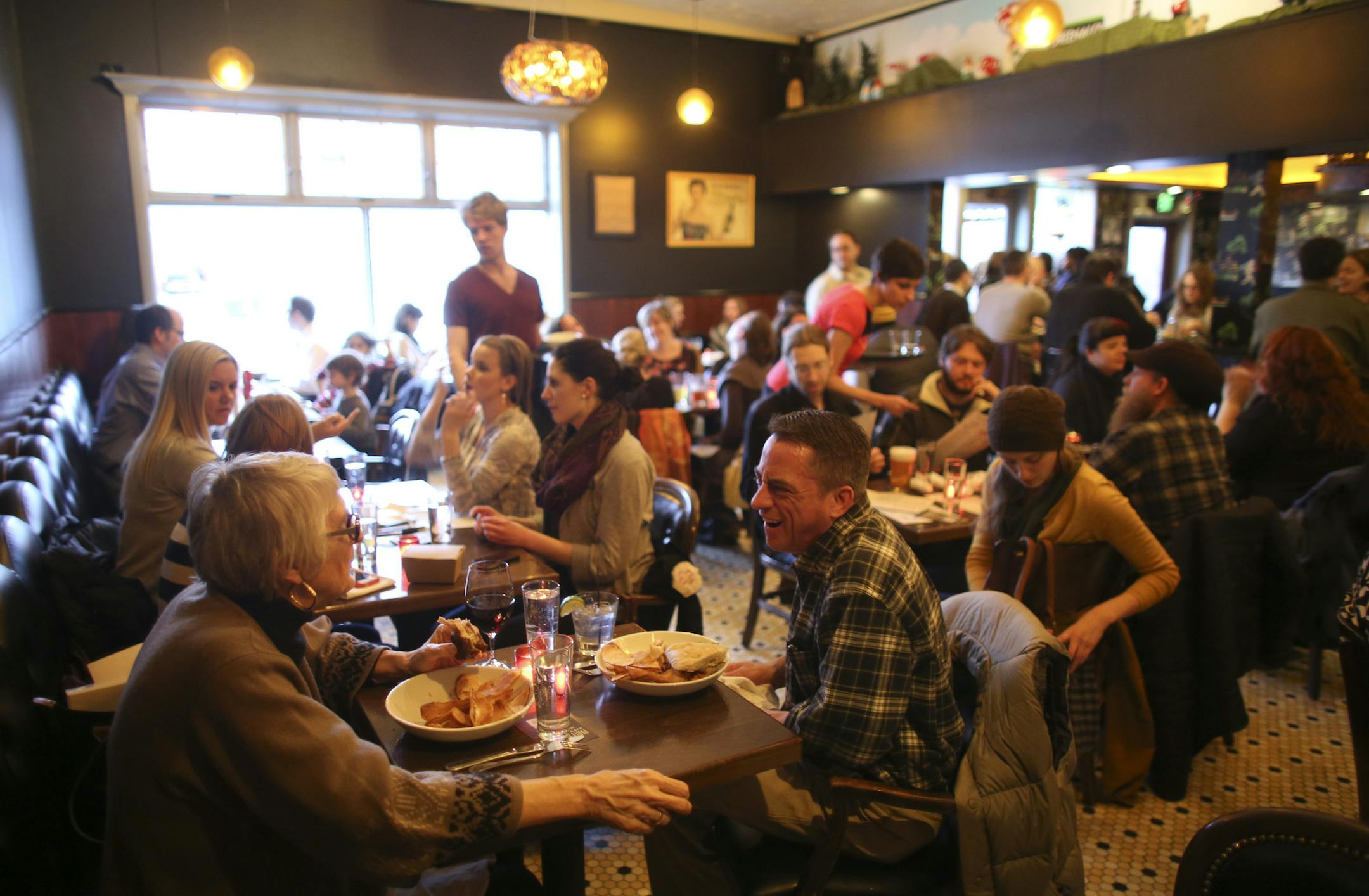 Minneapolis officials are tackling a 30-year-old rule that requires most of the city's bars to make 60 percent of their revenues from food. It's known around City Hall as the "60-40" rule. Keeping up with those ratios is particularly tough for businesses in Uptown, which has a thriving nightlife scene. Two city council members hope a change to 50-50 will ease the burden. Pat's Tap at 36th St. and Nicollet Ave. S. in Minnneapolis, Minn. does a robust business in food. Carol Oosterhuis and Jim Lon