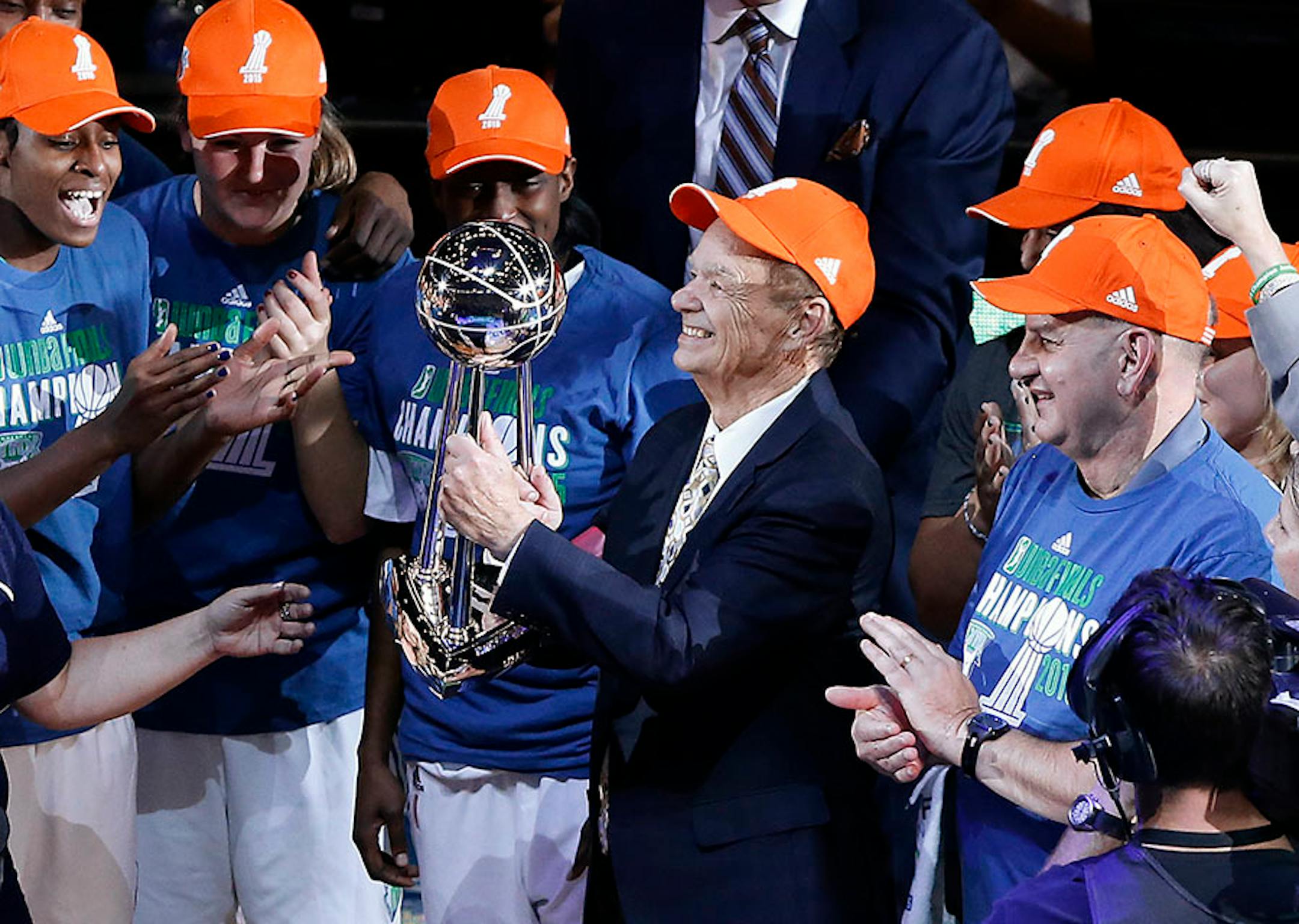 Minnesota Lynx owner Glen Taylor holds the championship trophy after beating the Indiana Fever 69-52 in Game 5 of the WNBA basketball finals, Wednesday, Oct. 14, 2015, in Minneapolis.