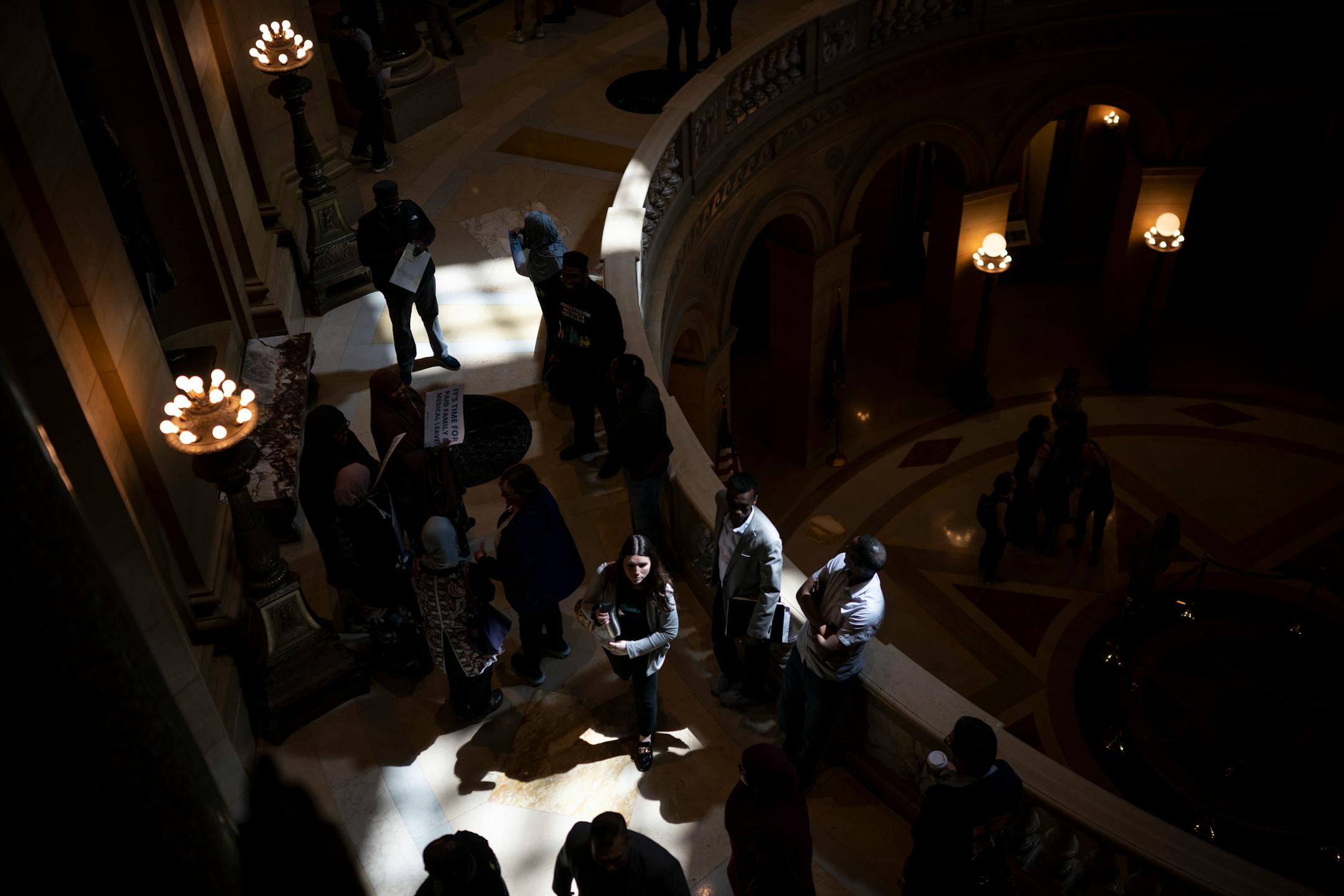 Paid family leave advocates gather for a rally Monday at the Minnesota State Capitol.