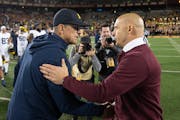 Michigan’s Jim Harbaugh shook hands with Minnesota’s P.J. Fleck after this fall’s game.