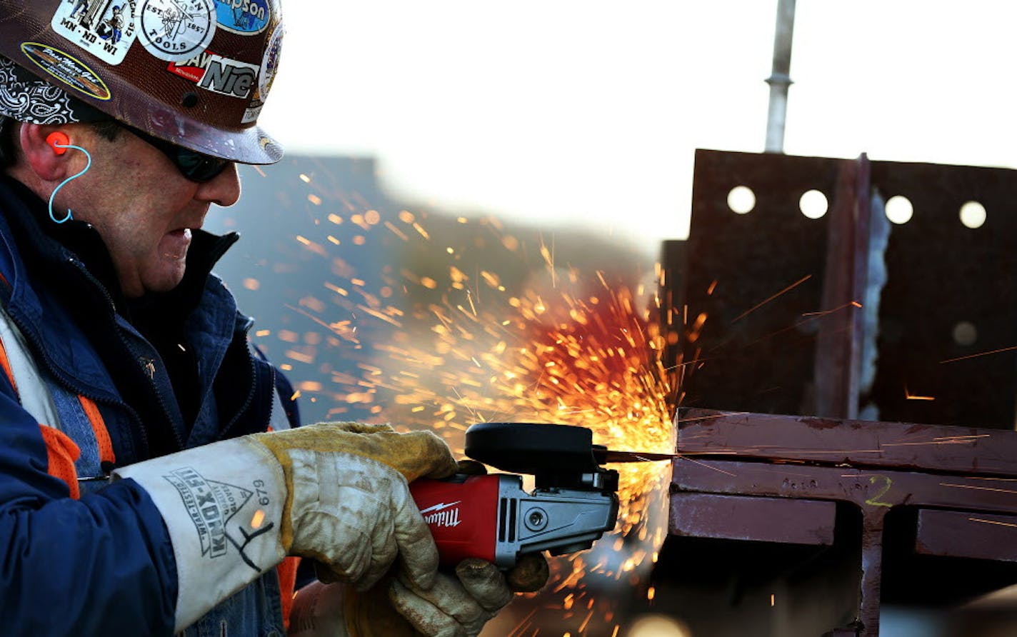 Iron worker Tom Franzini works on steel for the induration building of Essar Steel Minnesota's taconite plant in Nashwauk, Minn. ] LEILA NAVIDI leila.navidi@startribune.com / BACKGROUND INFORMATION: Friday, October 31, 2014. Essar Steel Minnesota recently ramped up construction on an $1.8 billion taconite plant after securing the funding needed to complete the project. The plant endured several delays over the past two years as funds periodically ran dry and some contractors were paid late and w