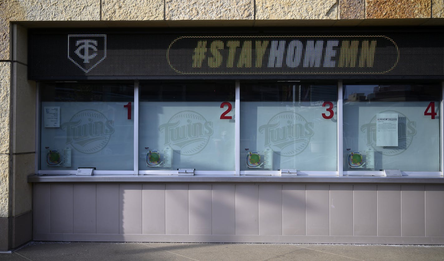 The Twins Box Office was shuttered Thursday evening, as a #STAYHOMEMN sign was digitally displayed above.