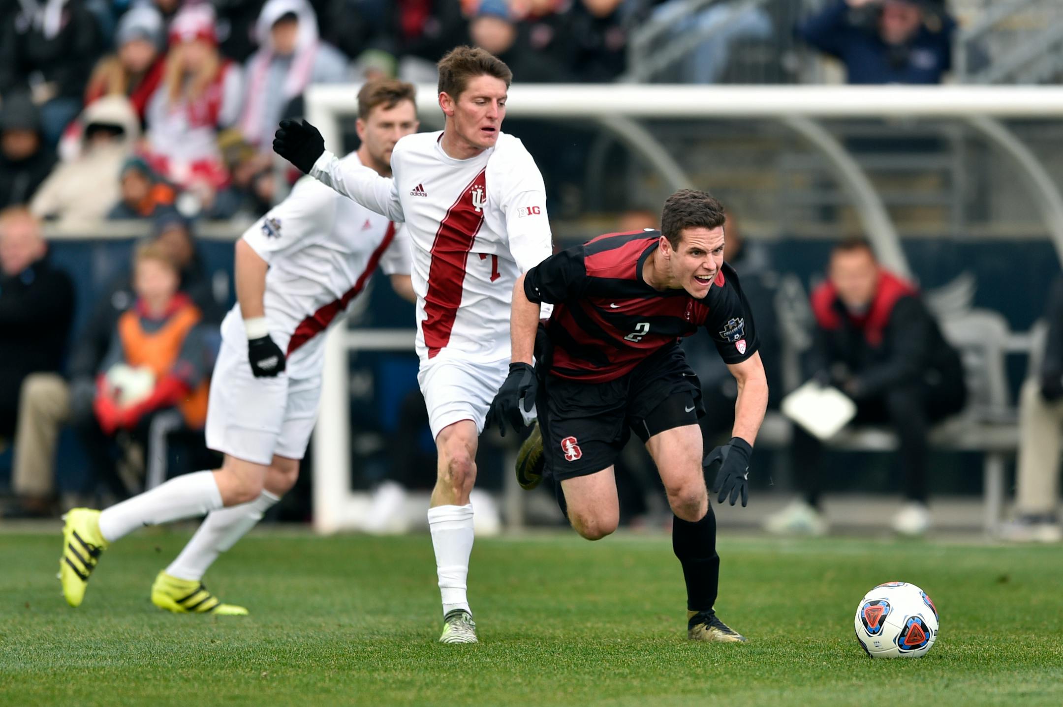 Stanford's Foster Langsdorf is knocked off the ball by Indiana' Trevor Swartz during the second half of the NCAA College Cup championship soccer match, Sunday, Dec. 10, 2017, in Chester, Pa. Stanford won 1-0 in over time. (AP Photo/Derik Hamilton)