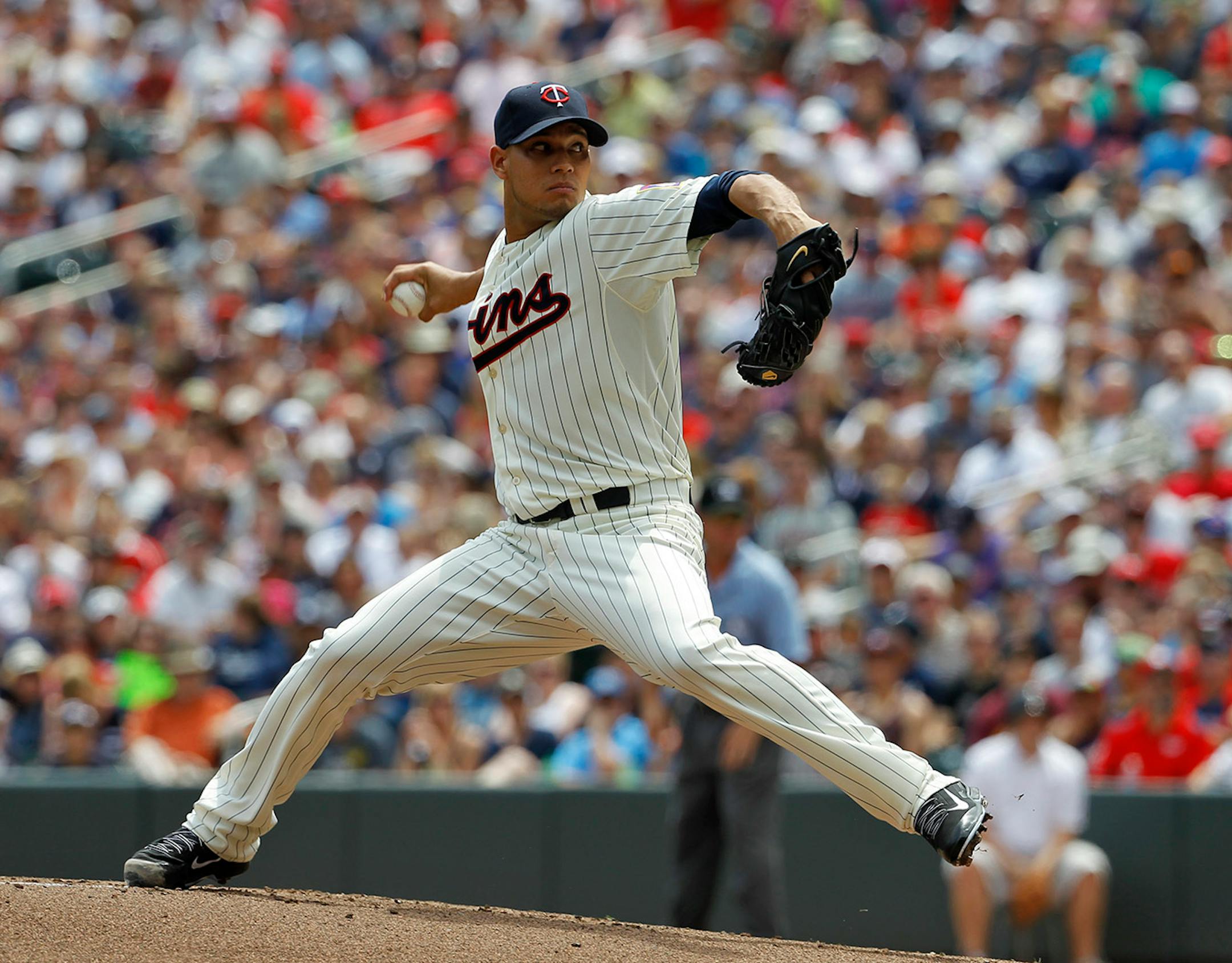 Minnesota Twins starting pitcher Yohan Pino delivers to the New York Yankees during the first inning of a baseball game in Minneapolis, Saturday, July 5, 2014. (AP Photo/Ann Heisenfelt)