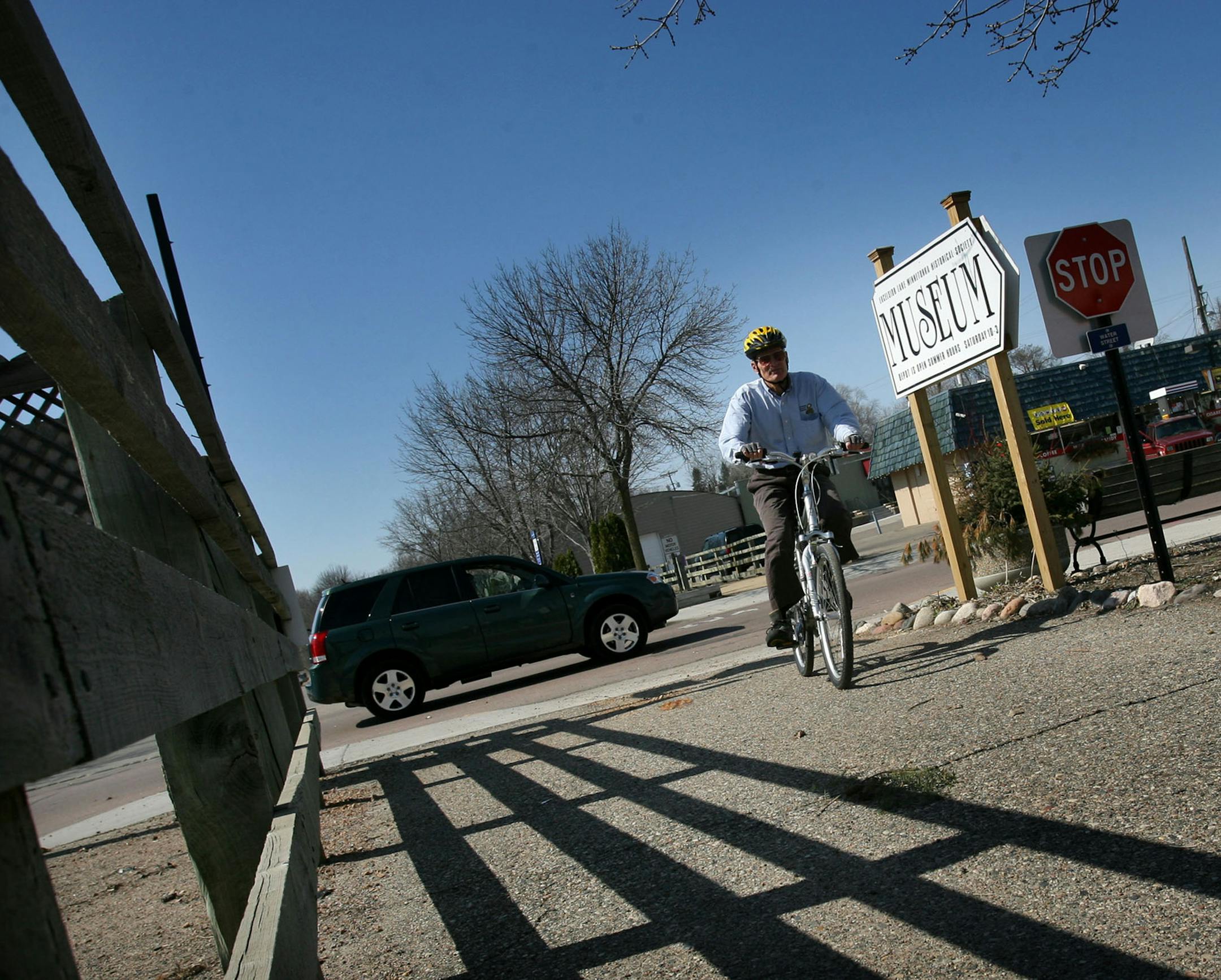 DAVID JOLES ï djoles@startribune.com Excelsior, MN - April 15, 2008-] After zig zagging through traffic on Water Street a bicyclist reconnects to the Lake Minnetonka bike trail. About 100,000 people use the trail each summer. This crossing, however, on Water Street angles across the street, a design the city says is an accident waiting to happen. They would like to square up the crossing.