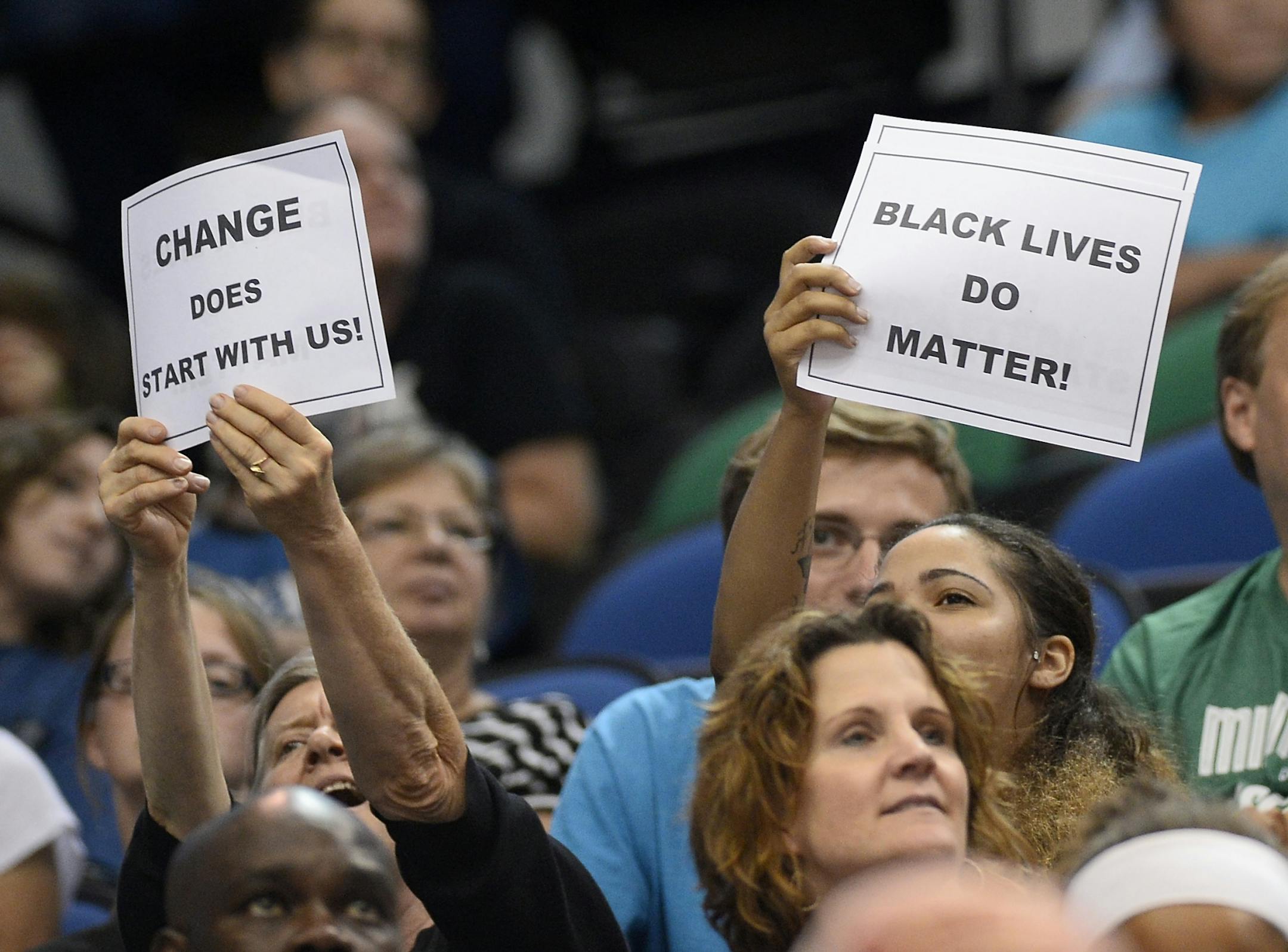 Fans held up Black Lives Matter signs during the fourth quarter of Friday night's Lynx game against the Seattle Storm.