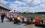 Fans settle in for a preview of what will be a AL East division matchup at Ed Smith Stadium, the Baltimore Orioles' spring training home.