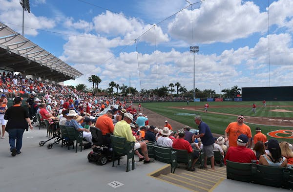 Fans settle in for a preview of what will be a AL East division matchup at Ed Smith Stadium, the Baltimore Orioles' spring training home.