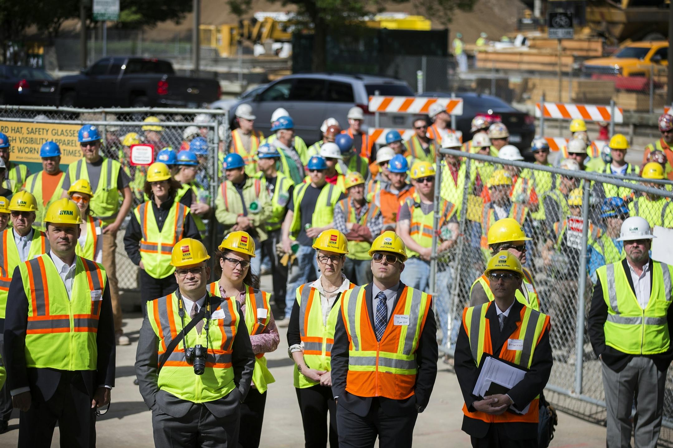 Invited guests and construction workers gather for speeches during a topping off ceremony for the new Wells Fargo towers by Ryan Companies in Minneapolis on Tuesday, June 2, 2015.