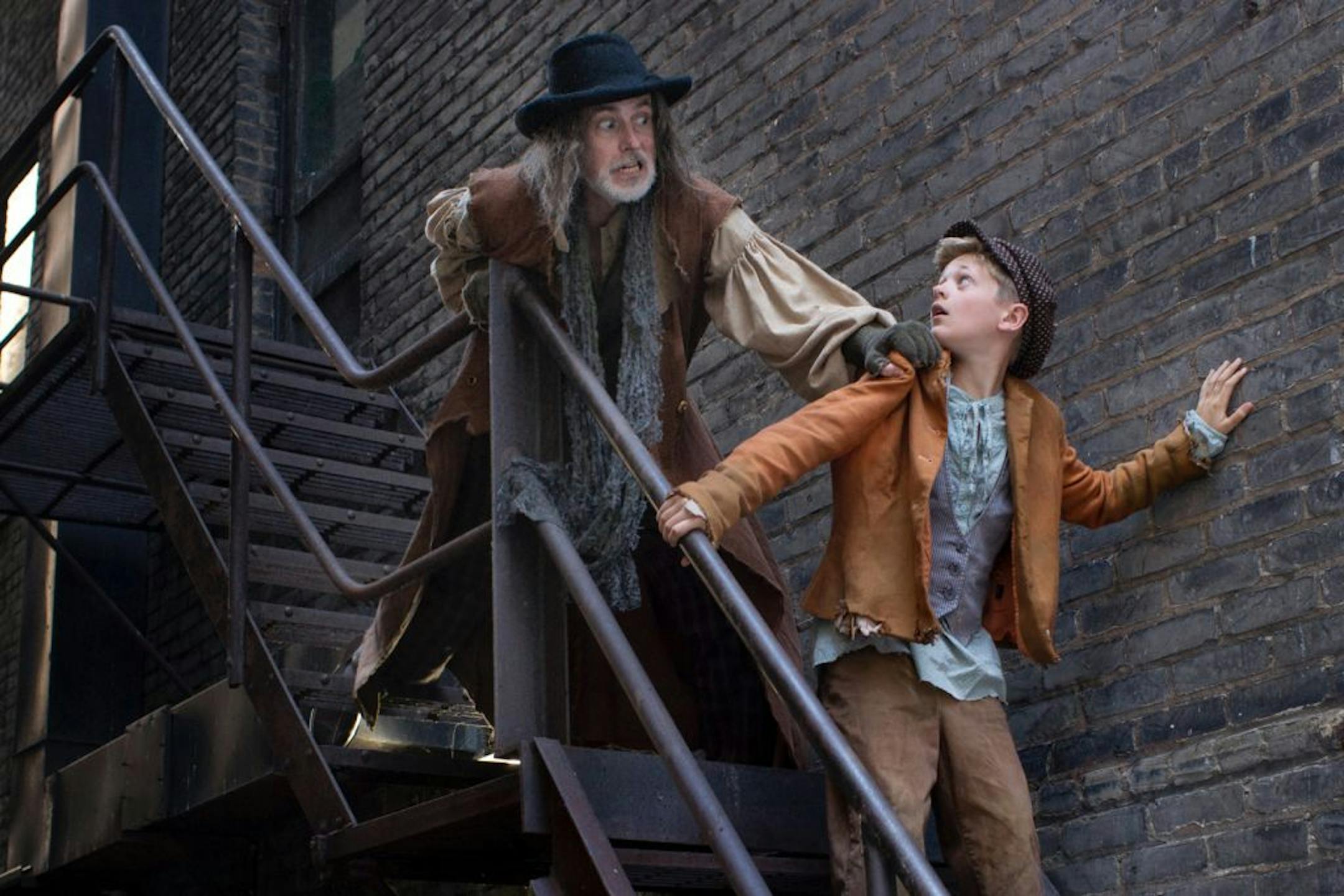 Noah Coon as Oliver Twist and Steve Hendrickson as Fagin in "Oliver Twist" at Park Square Theatre.