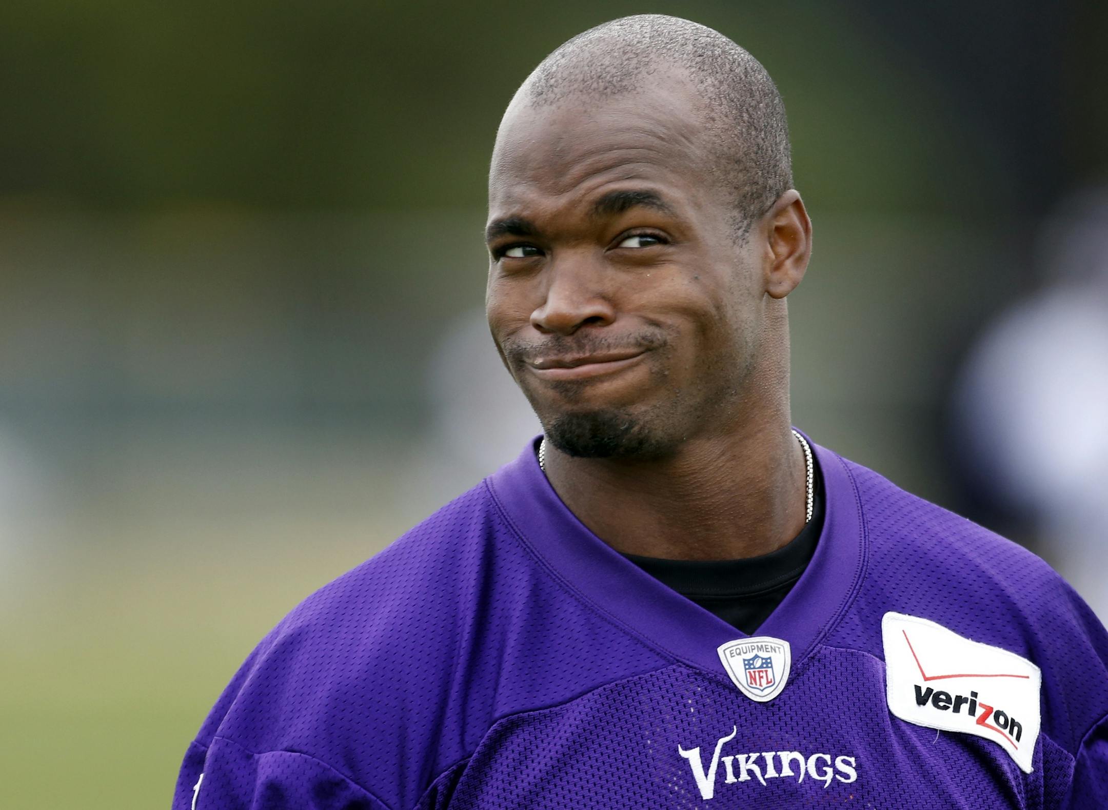 Minnesota Vikings running back Adrian Peterson (28) walked off the field at the end of the afternoon practice on Saturday.