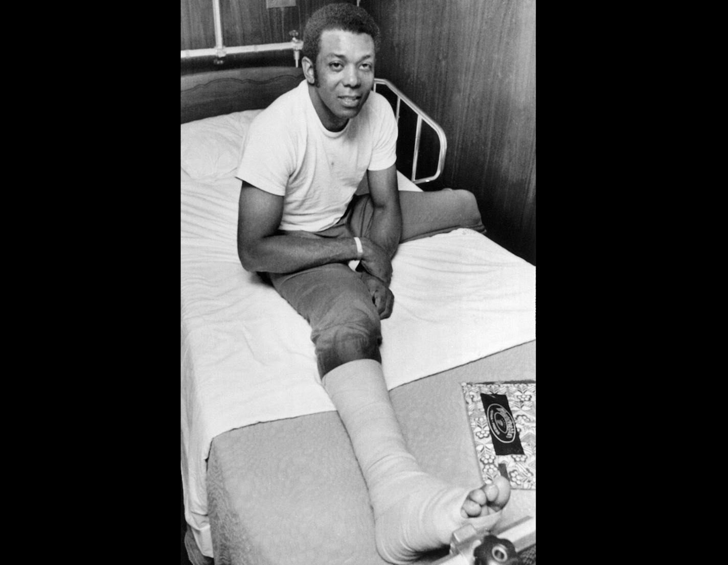 Tony Oliva of the Minnesota Twins, smiles from his hospital bed after surgery on his right knee to remove torn cartilage, in Minneapolis, Minn., Sept. 23, 1971. A team physician said Oliva, the American League's leading hitter with a .337 average, should be "raring to go" when spring training starts next February. (AP Photo/Robert Walsh)